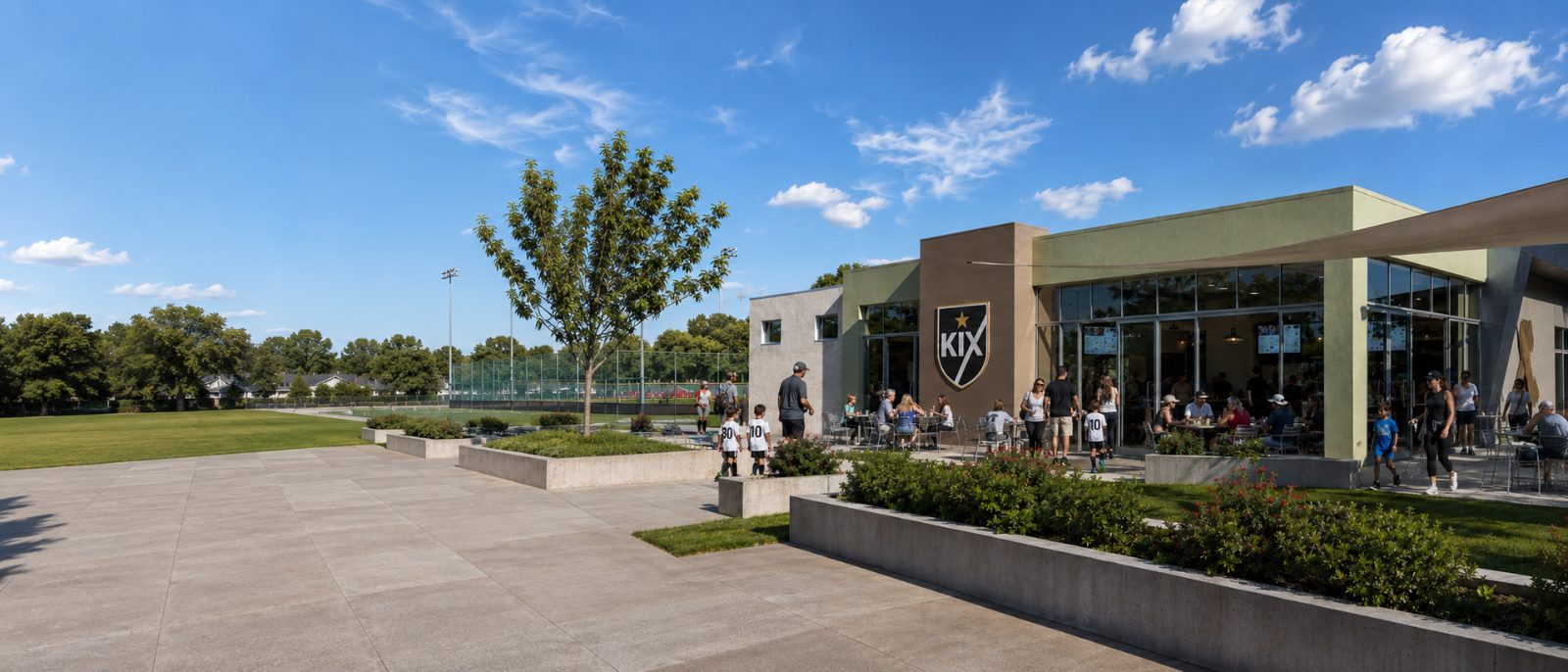 The KIX Pavilion with café terrace and visitors on a sunny day